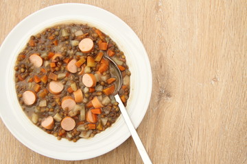 delicious freshly made lentil soup with a sausage