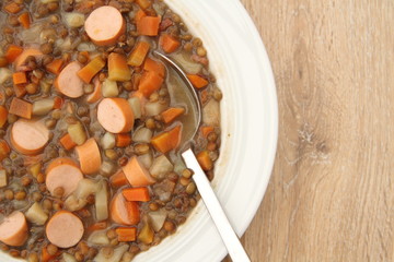 delicious freshly made lentil soup with a sausage