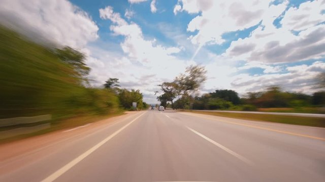 Time-lapse of driving fast speed a car on countryside road Thailand in the day time, POV shot 4k