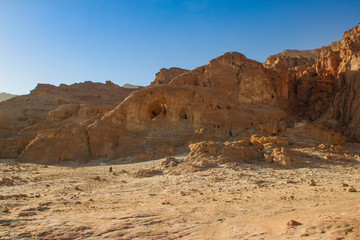 The famous Timna National Park in the desert in southern Israel in the Eilat region. Sand cliffs, dry land, red sand in the form of pillars and mushrooms. Sights of Israel.