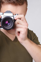 young man holding a camera