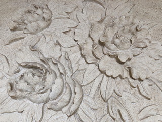 Low relief cement Thai style handcraft of rose flower