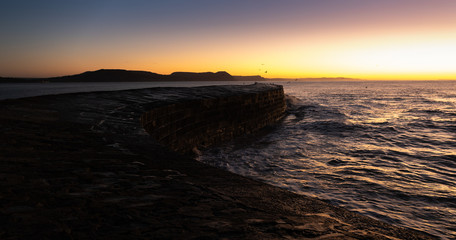 Obraz premium Morning sunrise over The Cobb