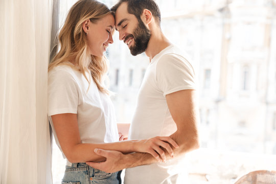 Smiling young couple embracing