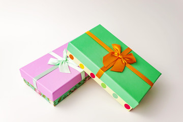 Pair gift paper cardboard boxes with bow on white background. Holyday present concept.