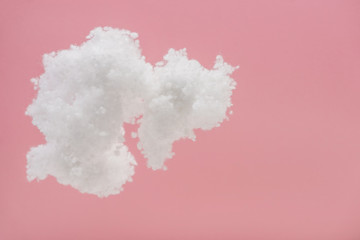 Fototapeta premium white fluffy cloud made of cotton wool isolated on pink