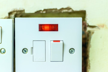 electric socket in a wall during renovation in england uk