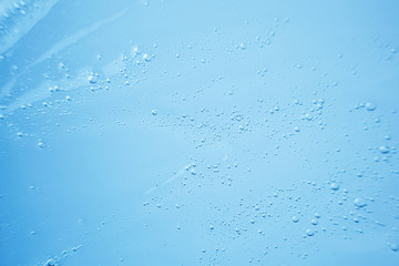 Fototapeta premium Close-up sample of cosmetic translucent gel. The concept of organic natural cosmetics, face and body care. Copyspace, minimalism, macro.