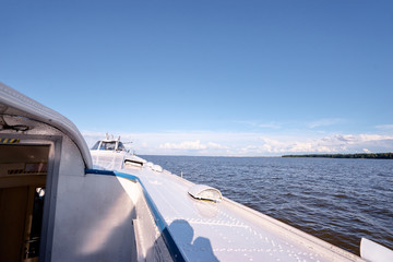 A wideshot view of the ship sailing through the calm waves of the bay. Saint Petersburg, Russia.