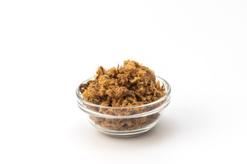 Domestic salty fried Pork greaves, duvan cvarci, in a Glass Bowl on a white background