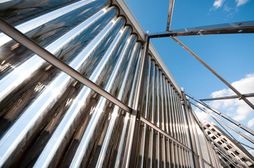 Vacuum solar water heating system on the house roof.