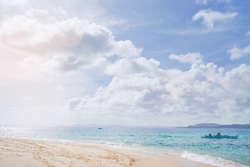 Beautiful landscape with tropical white sand beach with fishing boats. Siargao Island, Philippines.