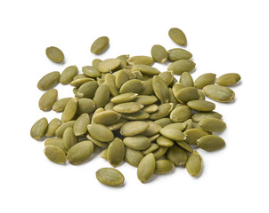 A pile of peeled pumpkin seeds isolated on white background