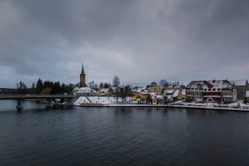 View on the church and lake in Mikolajki, Masuria, Poland