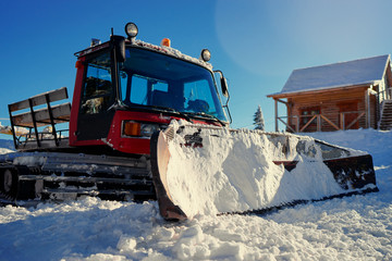 Huge snow machine truck outdoor.