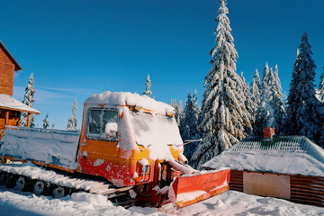Huge snow machine truck outdoor.