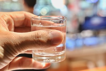 hand with glass of wine