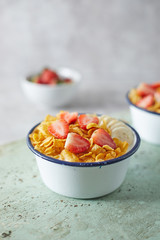 Bowl with cornflakes on background..