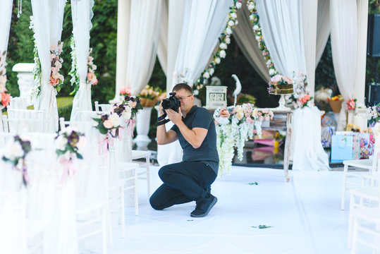 photographer making photos of wedding decoration