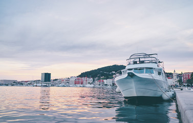 Travel by Croatia. Beautiful landscape with Split Old Town on sea shore. Yacht at the harbour.