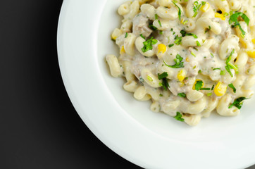 Cooked pasta with flaked tuna and sweetcorn in mayonnaise dressing