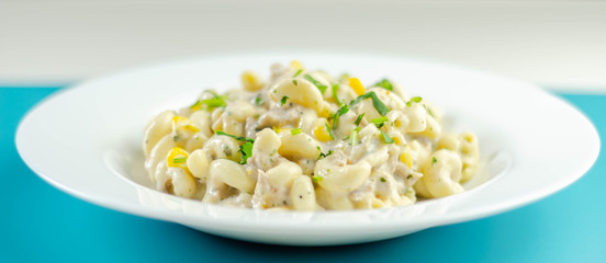 Cooked pasta with flaked tuna and sweetcorn in mayonnaise dressing