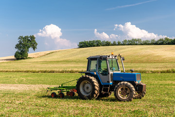 Blue vintage tractor in the field