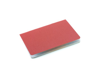 Red cover document, slightly ajar. White background