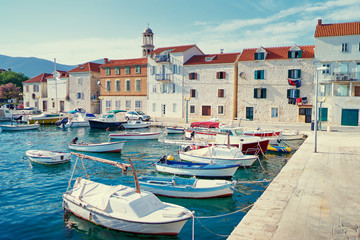 Fototapeta na wymiar Kastel coast in Dalmatia,Croatia. A famous tourist destination on the Adriatic sea. Fishing boats moored in old town harbor.