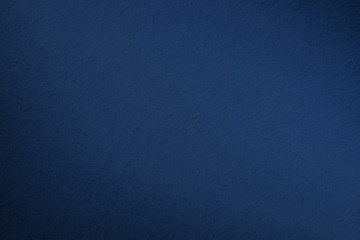 Bright blue stucco texture background on old wall. Trend hue, classic blue.