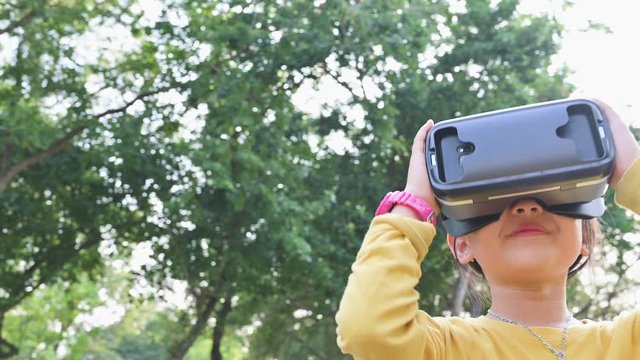 The 4K footage image of the girl using smart glasses or VR glasses. the concept of communication, internet of things and future life.