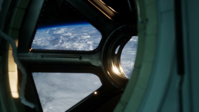 Cockpit view from International Space Station operating nearby of planet Earth. Elements of this image furnished by NASA.