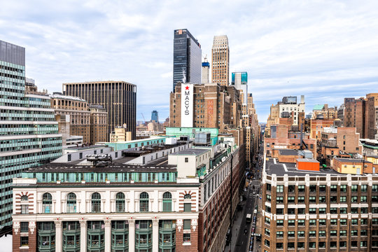 New York City, USA - April 7, 2018: High angle view of urban cityscape construction and rooftop building windows skyscrapers in NYC Herald Square Midtown with Macy's store