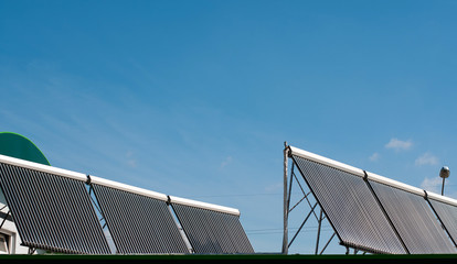 Vacuum solar water heating system on the house roof.