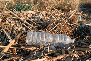 Plastic bottle waste on wild sea coast polluted vegetation ecosystem,planet save