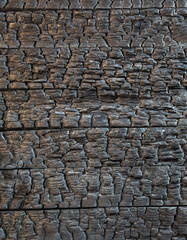wooden surface after the fire, charred surface