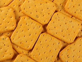 Salty crackers, snacks pile background and texture, top view