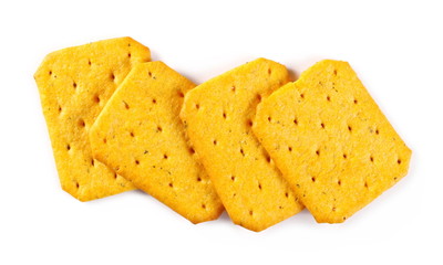 Salty crackers, snacks pile isolated on white background, top view