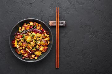 Kung Pao Paneer at black slate background. Kung Pao Paneer is a vegetarian version of chinese...