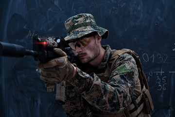 Fototapeta premium soldier in action aiming laseer sight optics