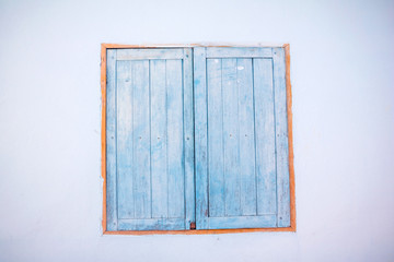 Old house blue window. window on traditional wooden building in Bangkok.Thailand, Old house , town style, vintage background