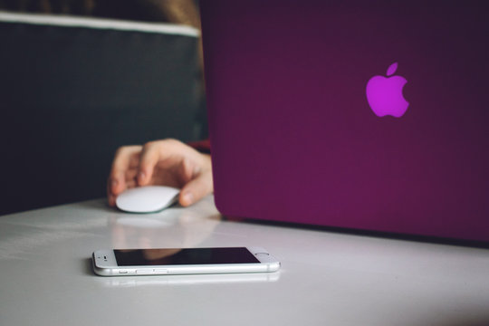 KROPIVNITSKIY, UKRAINE &ndash; 12 JANUARY, 2019: Man hands working on modern macbook, iphone, laptop. Developing programming and coding technologies. Programmer working in office, co-working