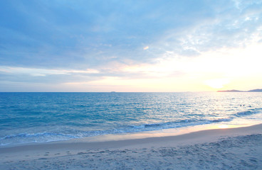 The evening sea with the sunset and black clouds