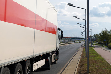 Truck in city traffic. A multi-lane road. Poland. Warsaw.