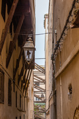 Fototapeta na wymiar Old broken street lamp in the medina of Fes el Bali in Morocco
