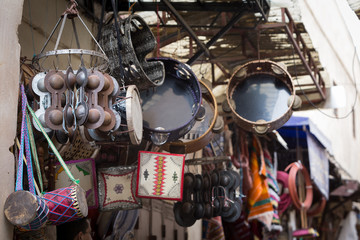 Music instruments outside the shop of a merchant in the souk of the medina of Fes in Morocco