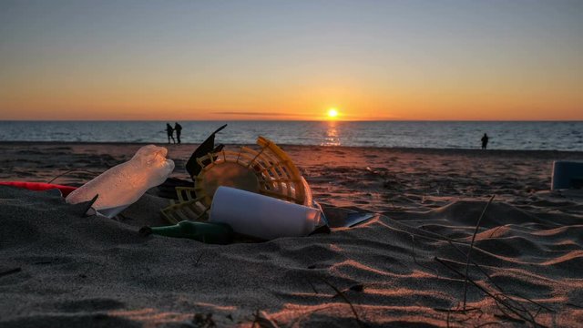 Plastic Garbage pile on sunset sea coast motion,polluted nature,people timelapse