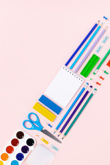 School and university supplies on pink background. Flat lay, top view, copy space.