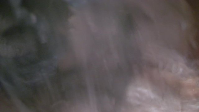Close Up Clothes In Washing Machine, Water Dropping, Slow Motion Spin
