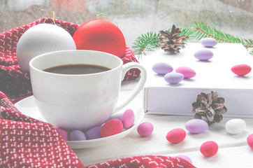 Obraz na płótnie Canvas New Year's concept: coffee, book, warm scarf
